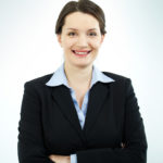 Portrait of happy office worker looking at camera